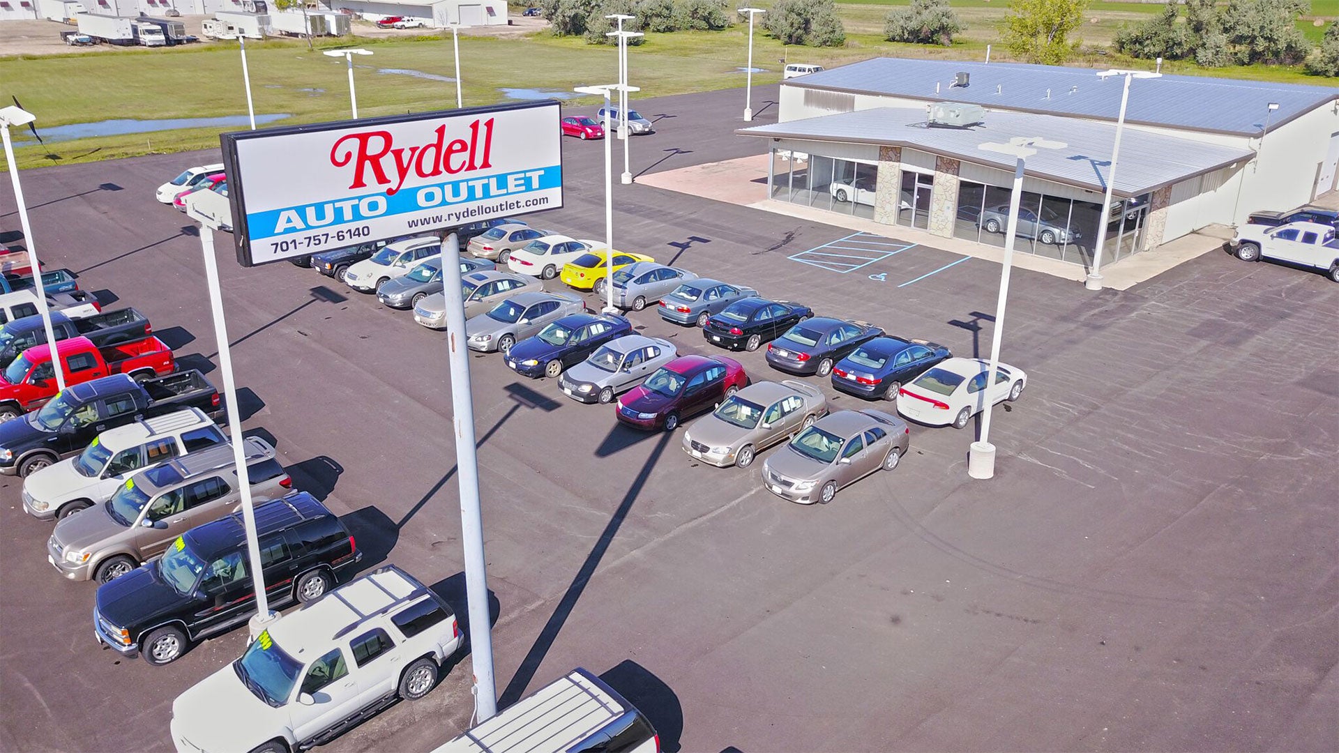 The used car lot at Rydell Outlet, serving Grafton